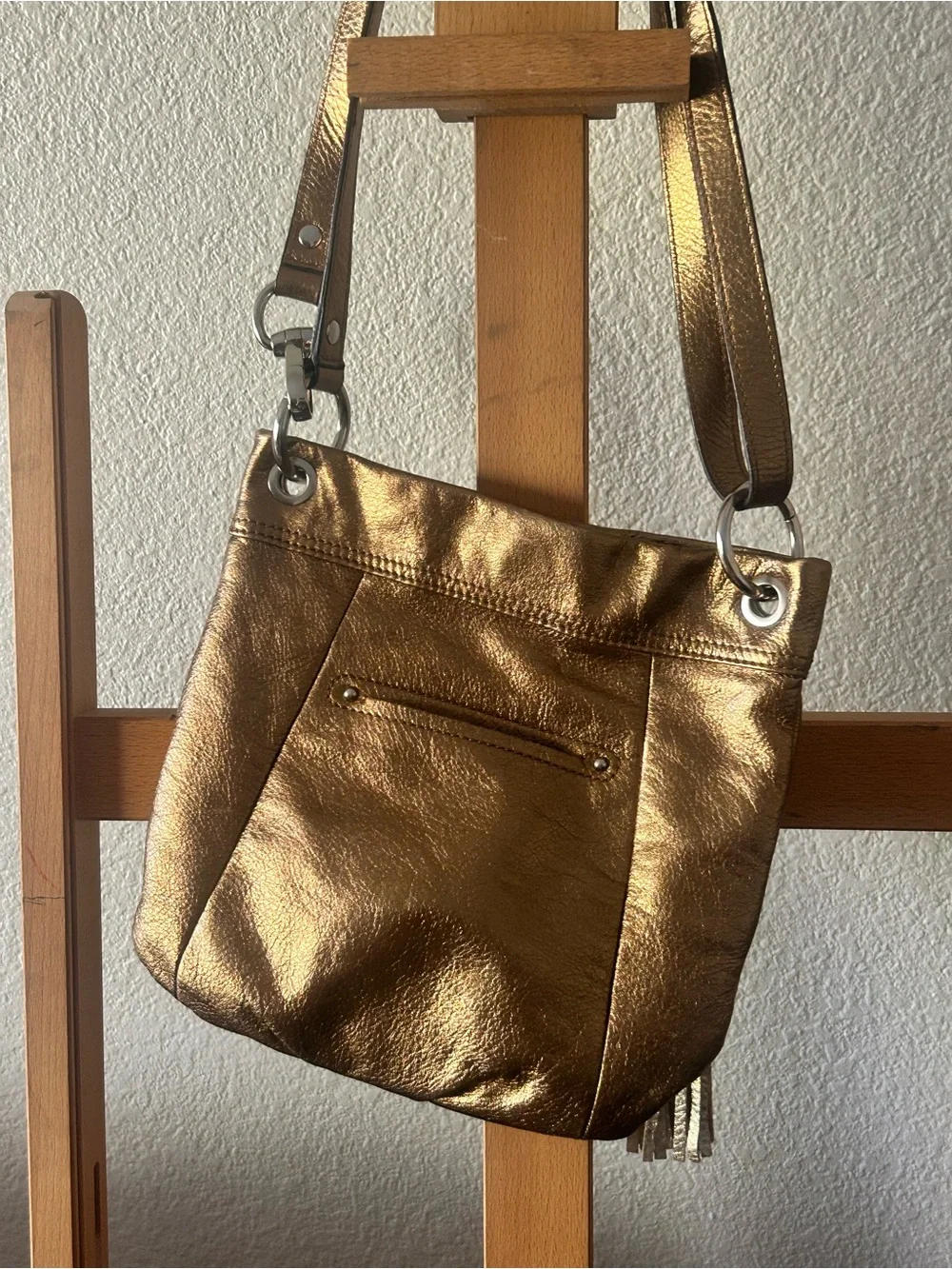 b. makowsky Metallic Gold Crossbody with Tassel Accent